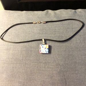Ribbon necklace with blue and silver pendant